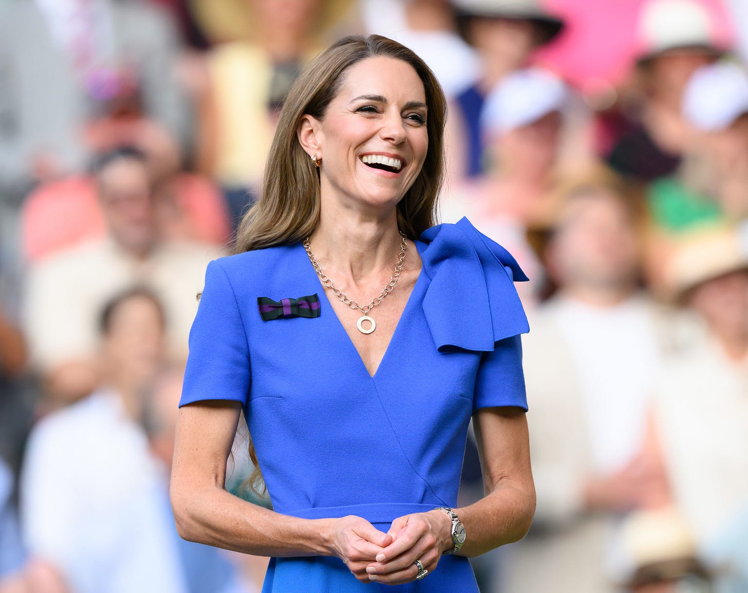 Princess Catherine wearing a blue dress smiling
