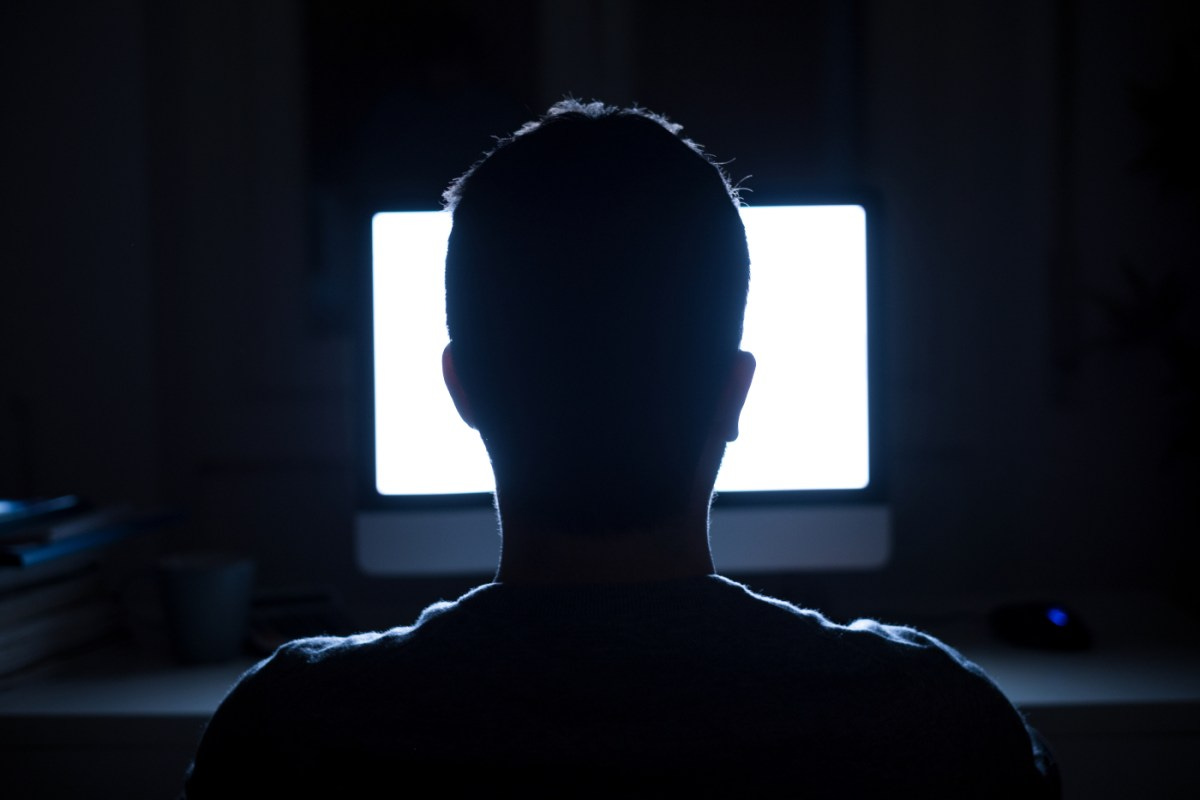 Churches use 'shameware’ apps to see when members look up 'atheism' online | A man sits in front of a computer