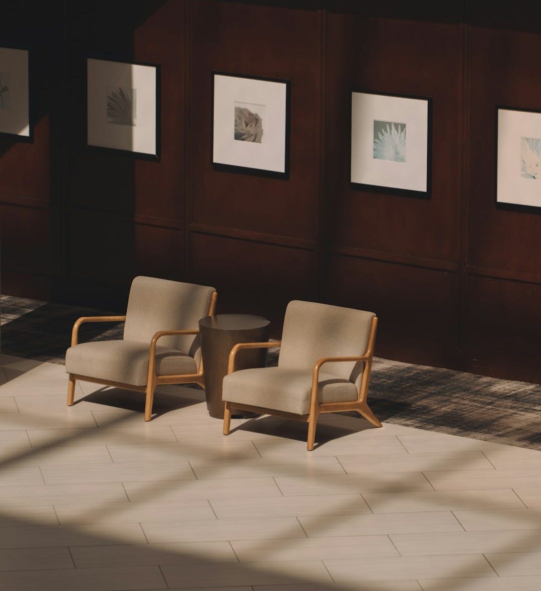 A room with chairs and pictures on the wall