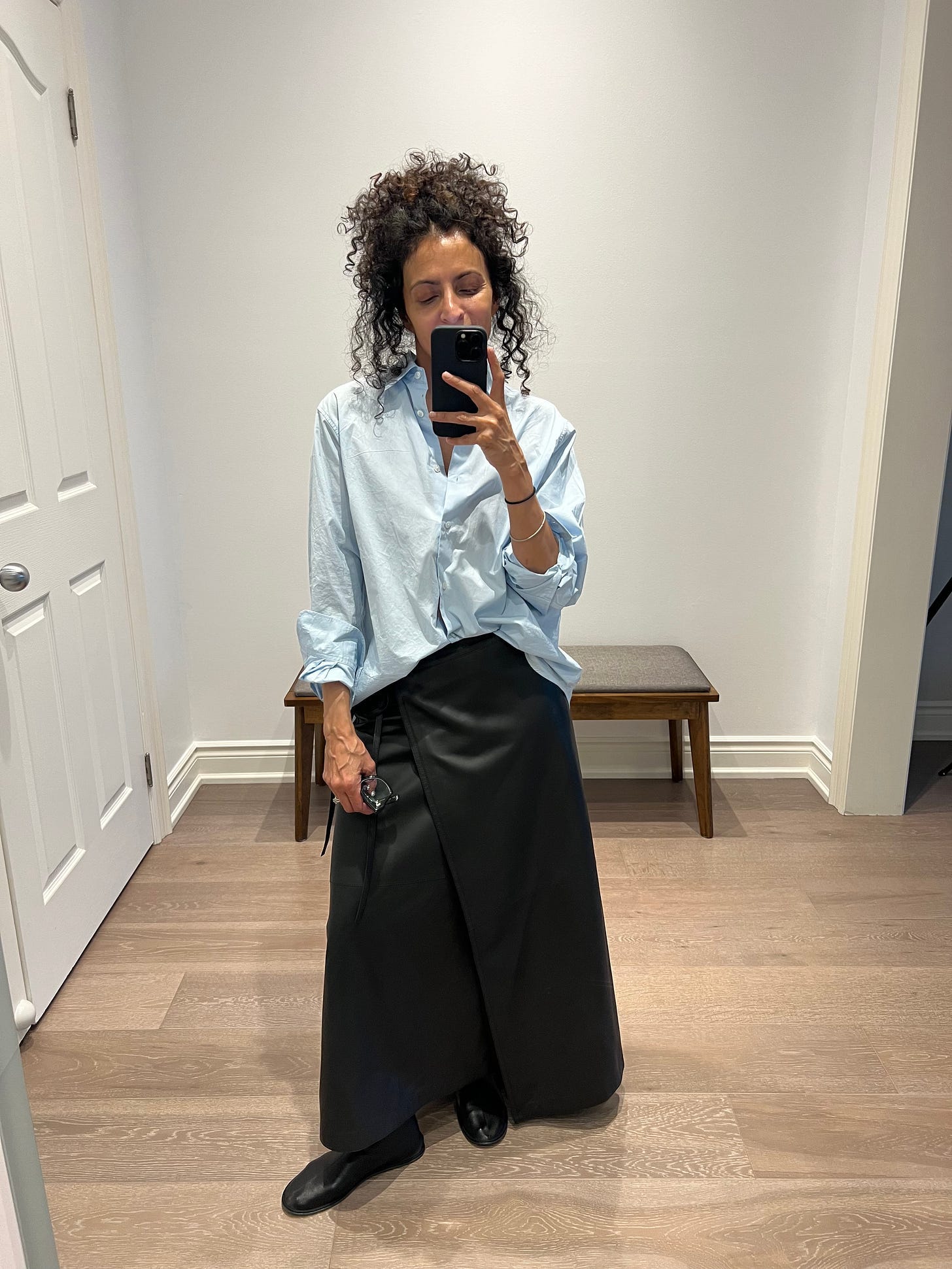 A person taking a selfie

Description automatically generated