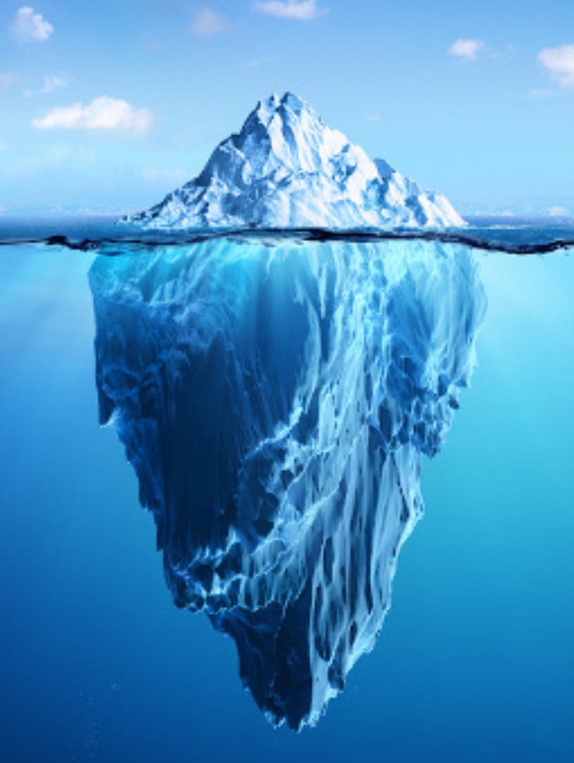 image of iceberg above and below the waterline