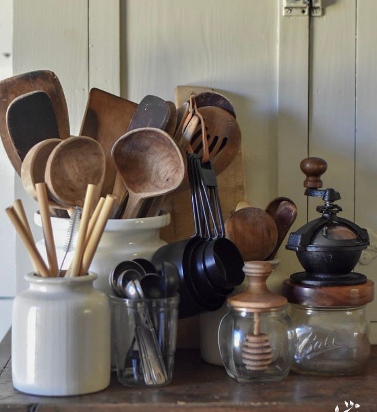 This may contain: an assortment of kitchen utensils and wooden spoons This may contain: an assortment of kitchen utensils and wooden spoons