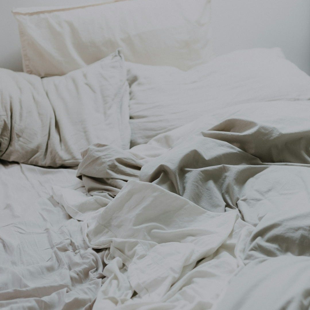 white pillows and bed comforter