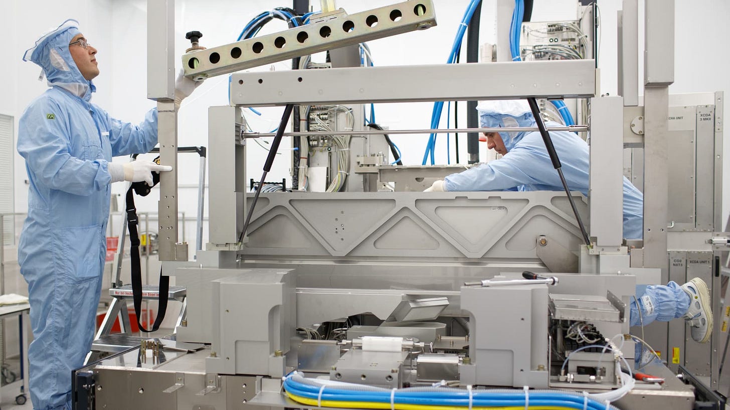 Employees assemble a ASML NXT1970Ci photolithography machine at the ASML Holding factory in Veldhoven, Netherlands. Employees assemble a ASML NXT1970Ci photolithography machine at the ASML Holding factory in Veldhoven, Netherlands.