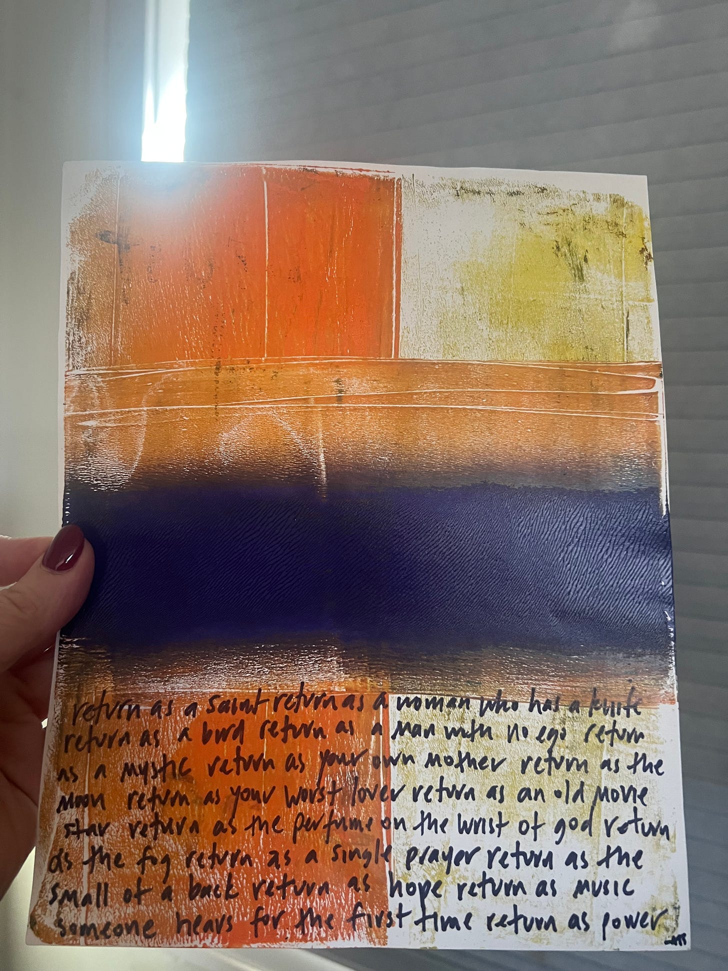 A hand holding a piece of art

Description automatically generated