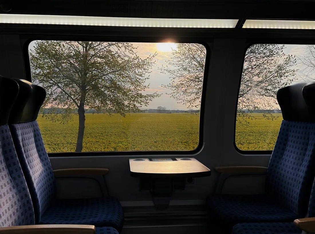 looking out the window of a train to the view outside