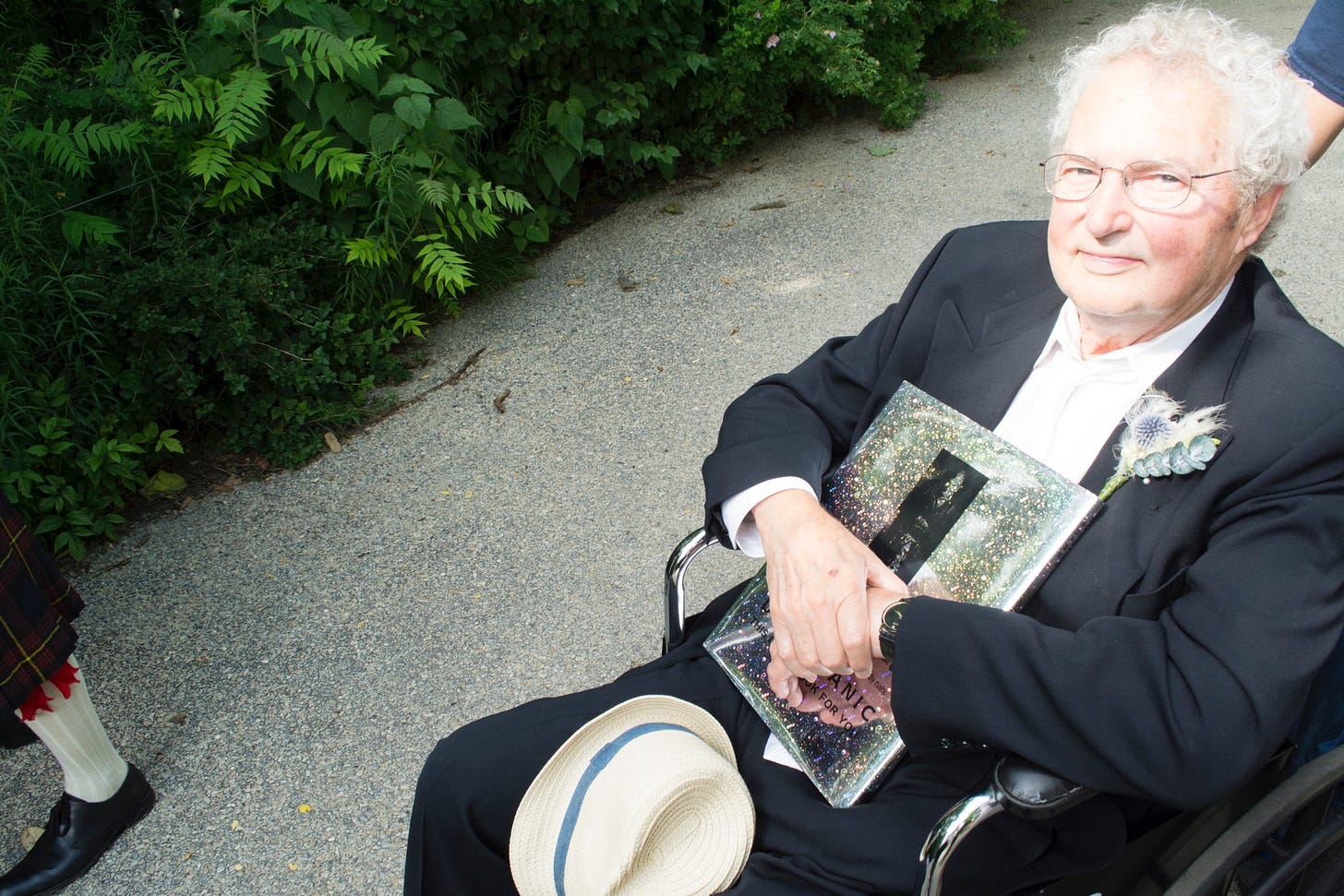 photo of art muir in a wheel chair at Owen muir's wedding