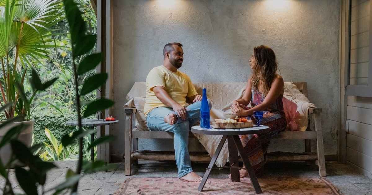 Couple talking and eating snacks in the Patio