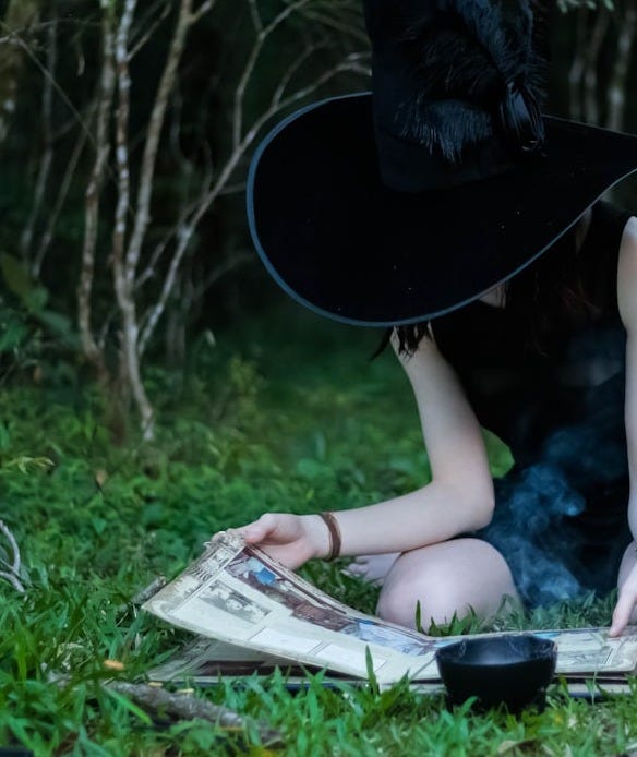 woman reading book while sitting on green lawn grasses woman reading book while sitting on green lawn grasses