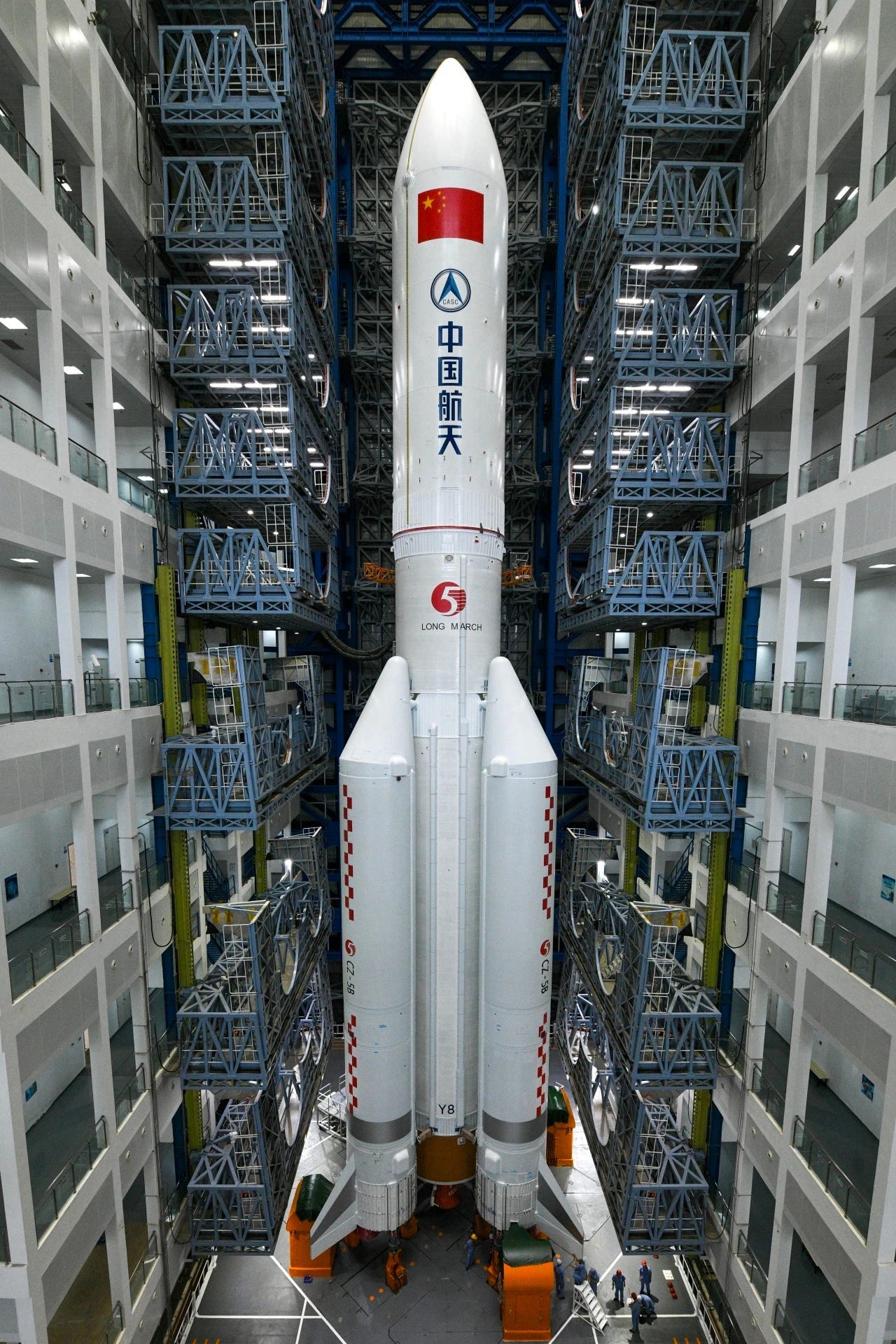 The Long March 5B Y8 launch vehicle preparing to leave the Wenchang Space Launch Site’s vehicle assembly building. The Long March 5B Y8 launch vehicle preparing to leave the Wenchang Space Launch Site’s vehicle assembly building.