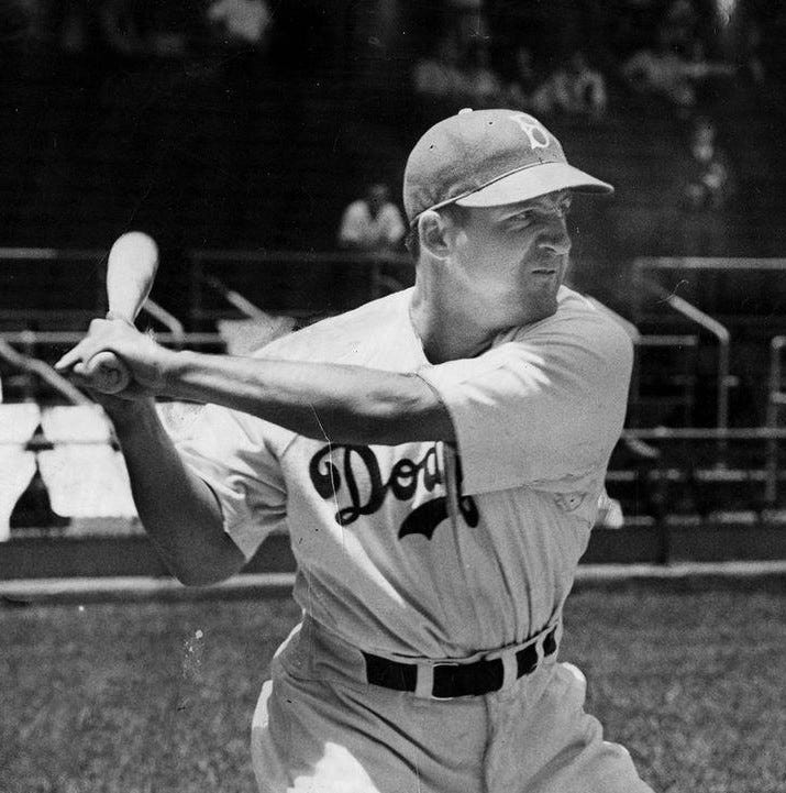 Pee Wee Reese and Joe Medwick holding bats.