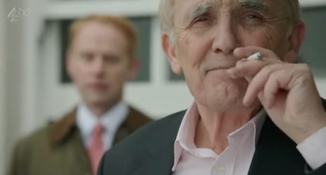 A person in a suit smoking a cigarette

AI-generated content may be incorrect.