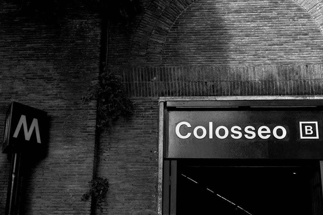a close up of a street sign near a brick wall a close up of a street sign near a brick wall