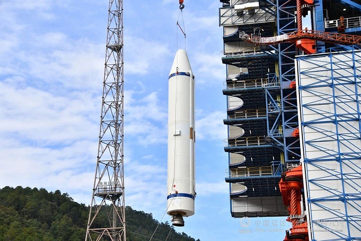 One of the Long March 3B/E's boosters and second-stage being lifted onto Launch Complex 3.