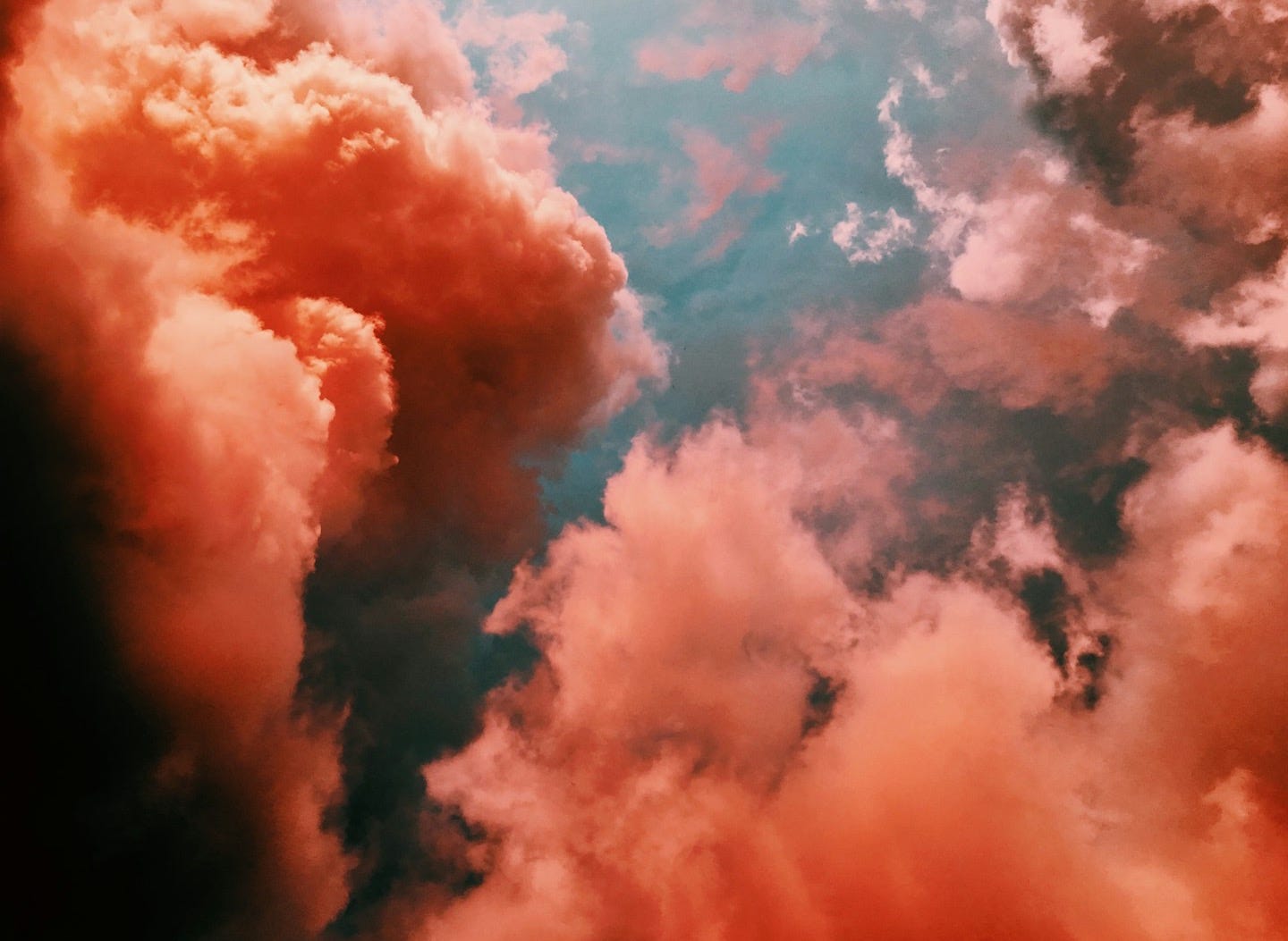 orange smoke on blue background orange smoke on blue background