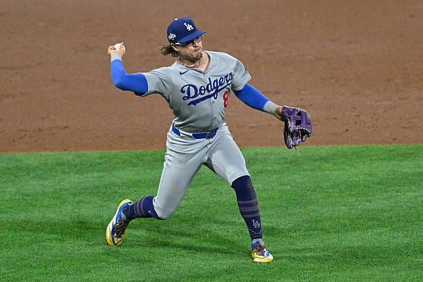 Los Angeles Dodgers first base Enrique Hernández throws to first base during the NLDS game between the Philadelphia Phillies and the Los Angeles...