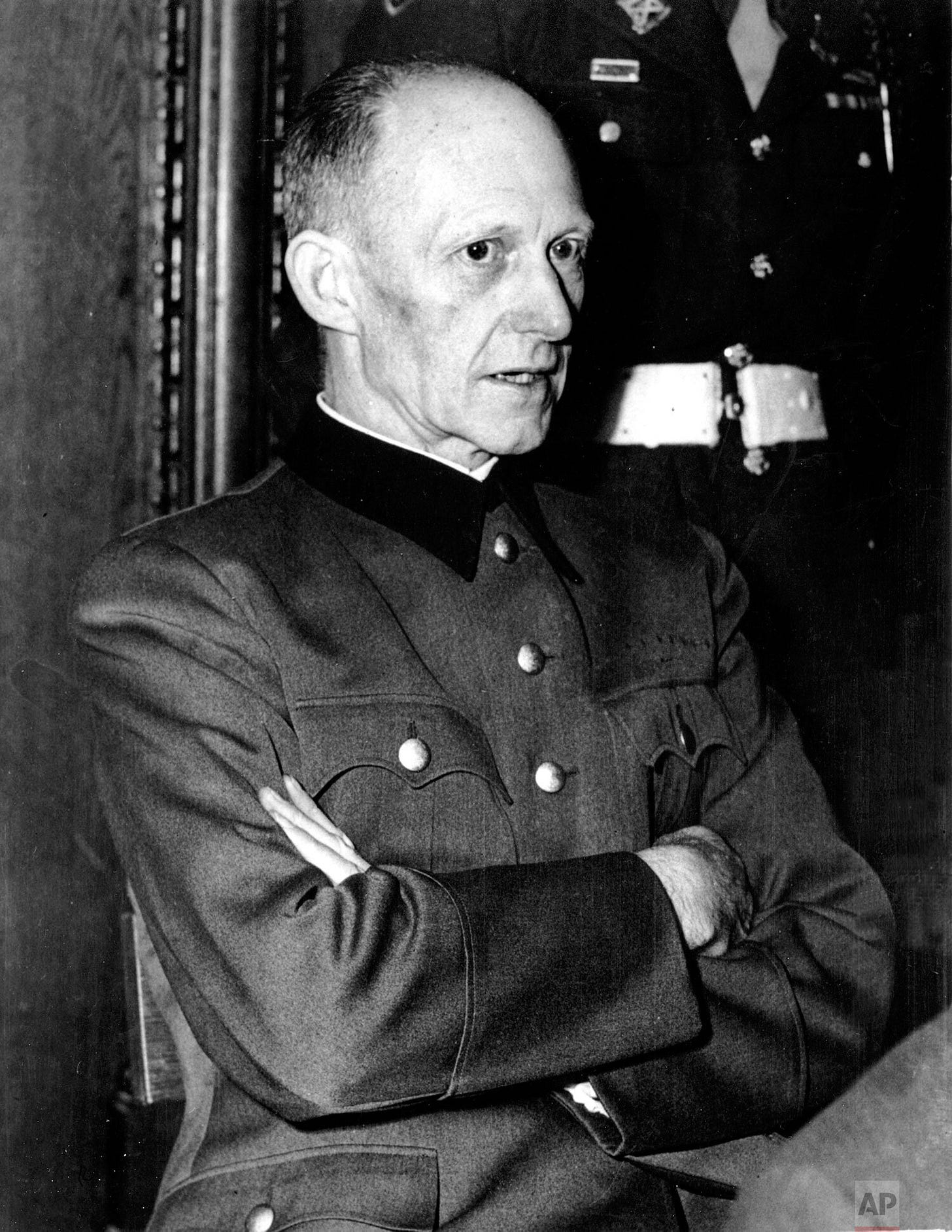Defendant Alfred Jodl, a former general and one of Adolf Hitler's key military advisors, observed with arms crossed during the Nuremberg War Crimes Trial on November 30, 1945, facing the consequences of his wartime role. Defendant Alfred Jodl, a former general and one of Adolf Hitler's key military advisors, observed with arms crossed during the Nuremberg War Crimes Trial on November 30, 1945, facing the consequences of his wartime role.