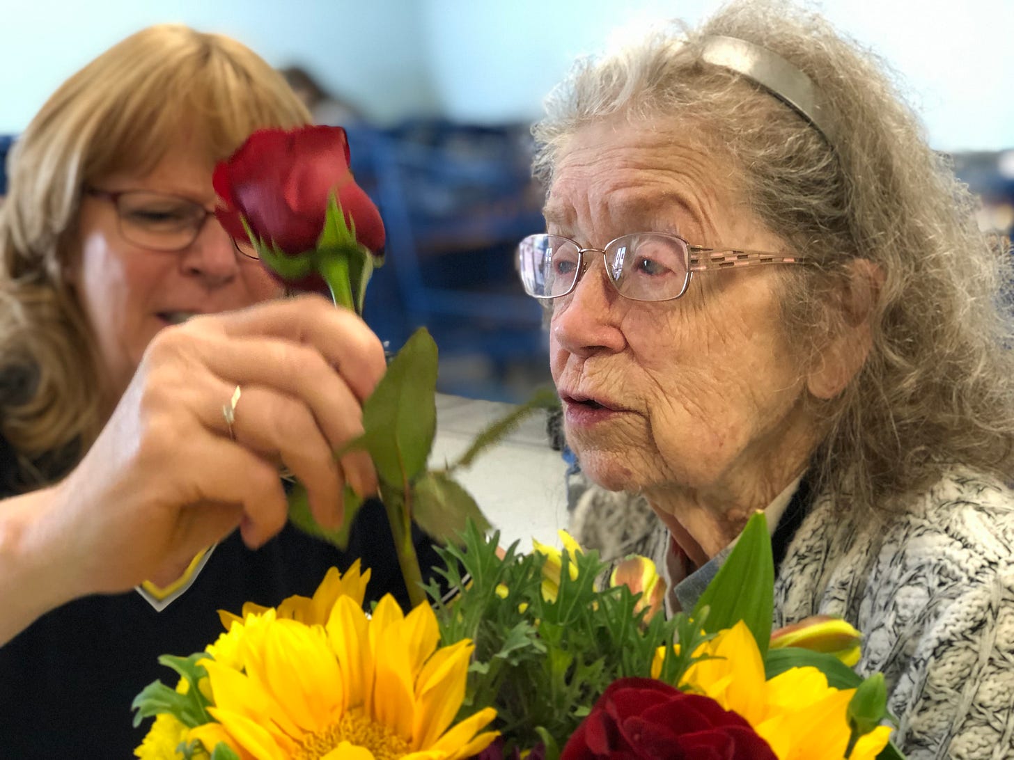 Cindee helping mom with flowers.