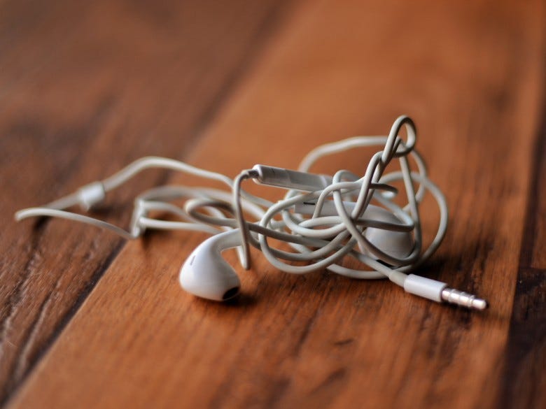 How tangled earbuds tell a story on society. | by Amadeus | Medium