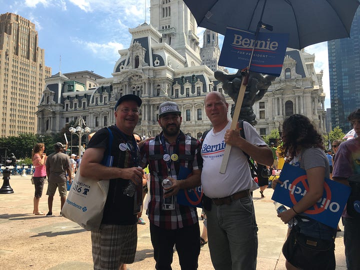 My Journey with Bernie book, DNC 2016, Independence Hall, Green glow-in-the-dark shirts, 2016 DNC Delegate Badge, Delegates, Protestors, and Volunteers in Philadelphia, Lighted FEEL THE BERN Shirt