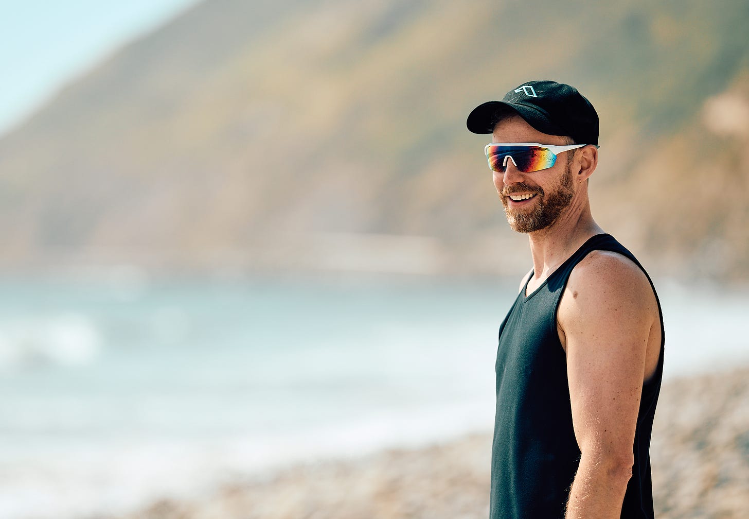 Portrait of a man wearing sunglasses and a cap at Thornhill Broome Beach