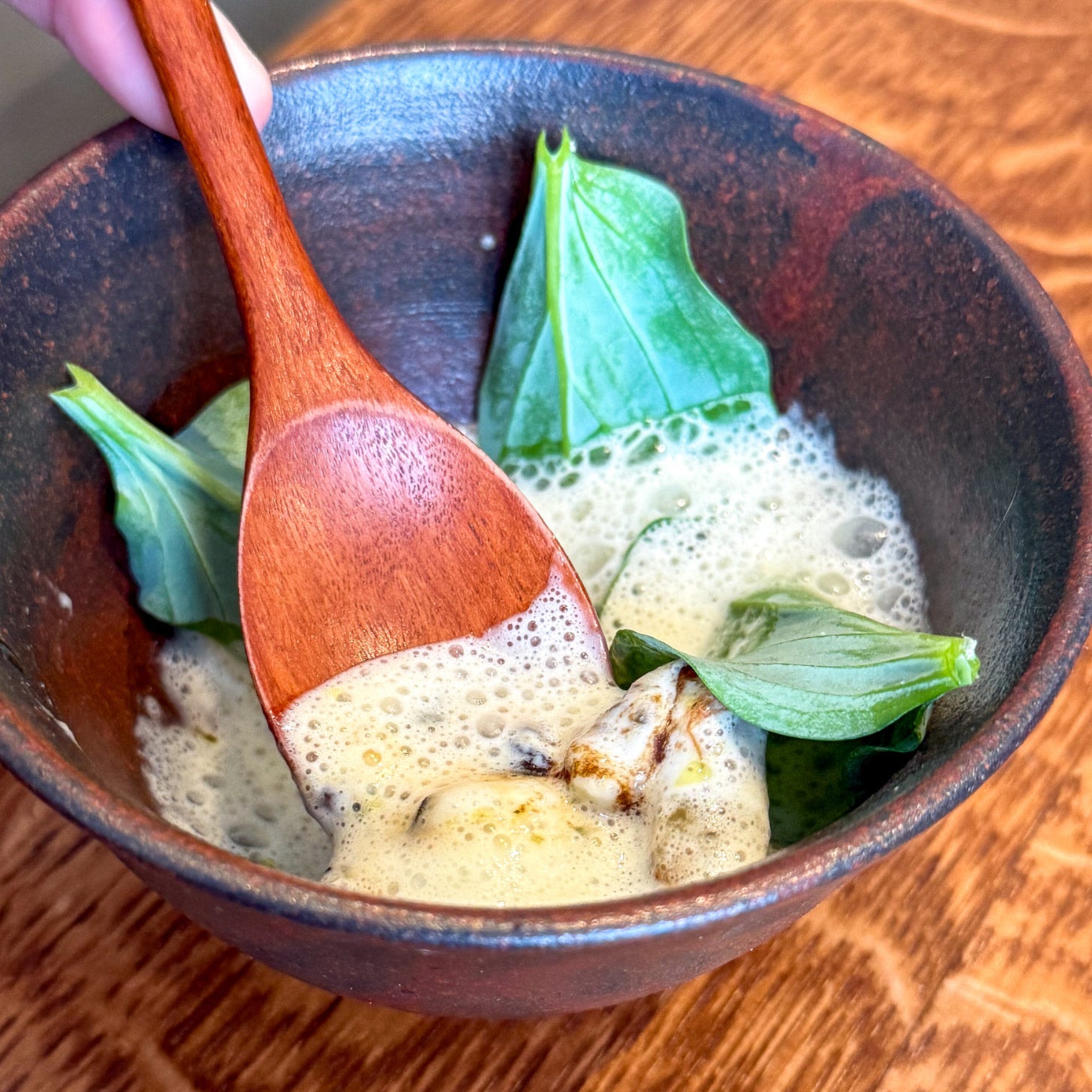Oyster in buttermilk foam with leeks and oyster leaf at Eme, Paris 4th