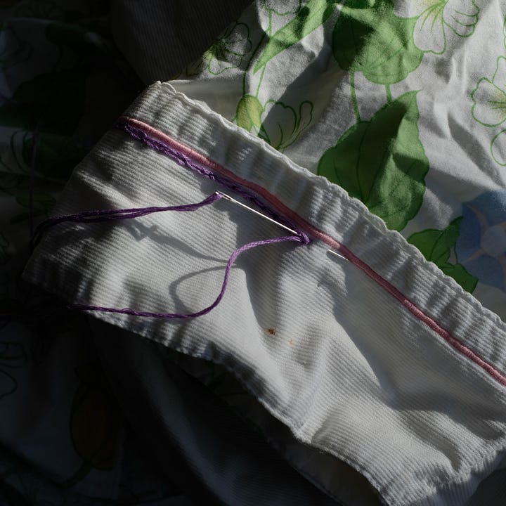 Building a web of connection - - walks in the snow and mending old clothes.
