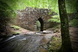 Poinsett Bridge. ~25 miles North of Greenville SC at lat/long coordinates: 35.129205, -82.384278 Poinsett Bridge. ~25 miles North of Greenville SC at lat/long coordinates: 35.129205, -82.384278