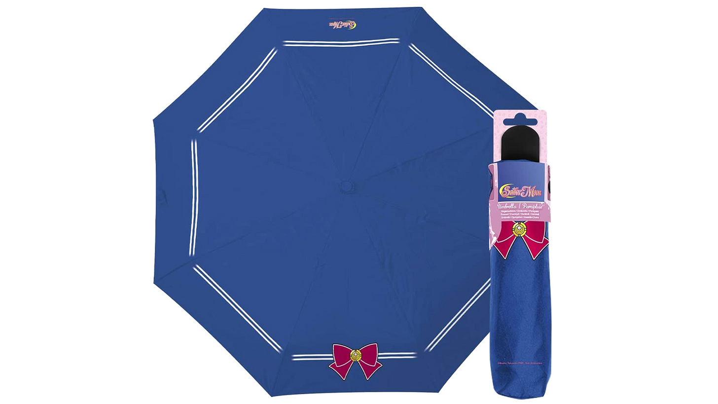 Blue and white Sailor Moon umbrella with red ribbon design.