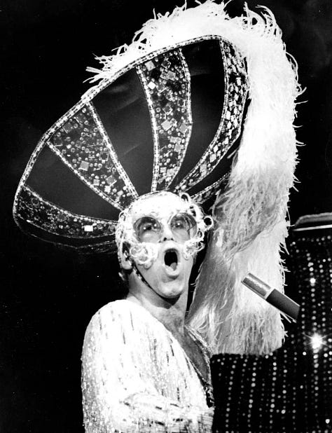 LEFT TO RIGHT: Sir Elton John (Don Preston, The Boston Globe); “Human Chain” installation (Yerbosyn Meldibekov); Devin the house-builder (GSAP News); Angela Lipps (Matt Henson); Humans mistaken for rocks (drone footage); Professor of law Matthew Kugler (Northwestern University)