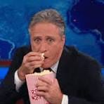 Jon Stewart GIF of him eating popcorn