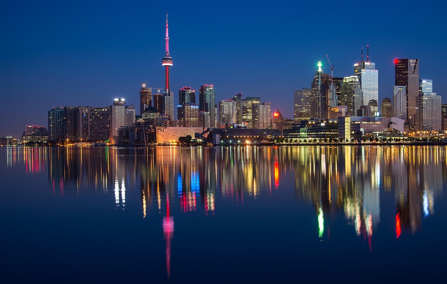 Toronto skyline at dusk reflecting on Lake Ontario, symbolizing Canadian urban diversity and political identity. Toronto skyline at dusk reflecting on Lake Ontario, symbolizing Canadian urban diversity and political identity.
