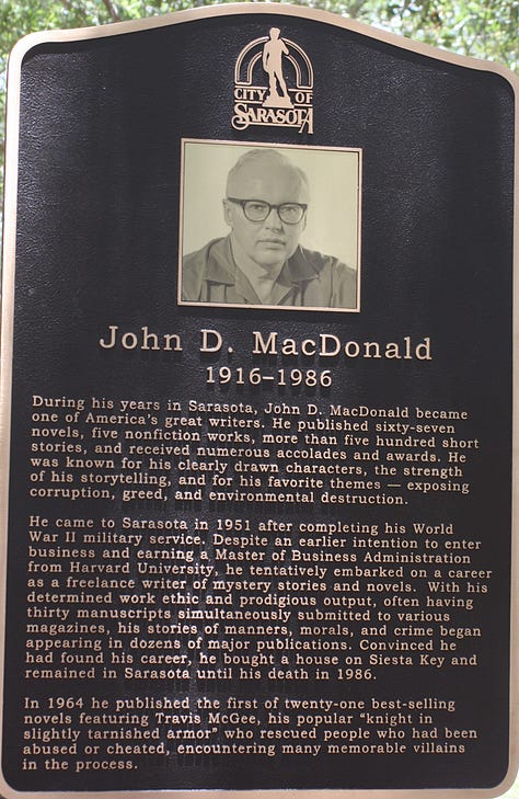 Sign commemorating novelist John D. MacDonald in 5 points