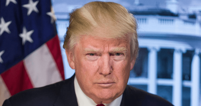 Donald Trump stares at the camera with the American flag in the background. But his stare doesn't scare me.