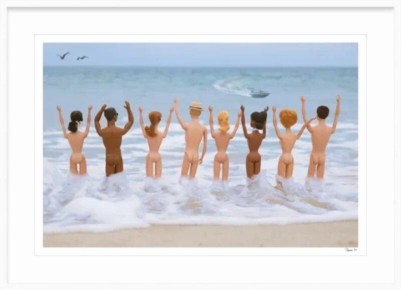 Framed photo artwork of vintage nude Barbie and Ken dolls standing hand-in-hand in ocean surf, facing the sea with arms raised in celebration, a boat in the distance and seagulls in the sky. Framed photo artwork of vintage nude Barbie and Ken dolls standing hand-in-hand in ocean surf, facing the sea with arms raised in celebration, a boat in the distance and seagulls in the sky.