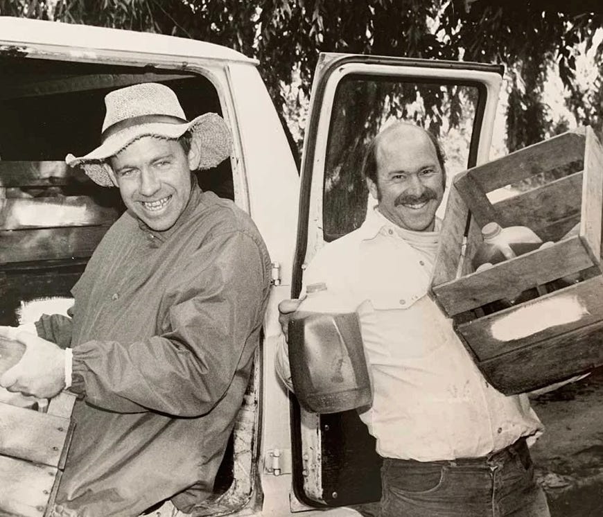 Orchard work in the early years.  Bill, to the left, still lives in the village and is now a weaver.