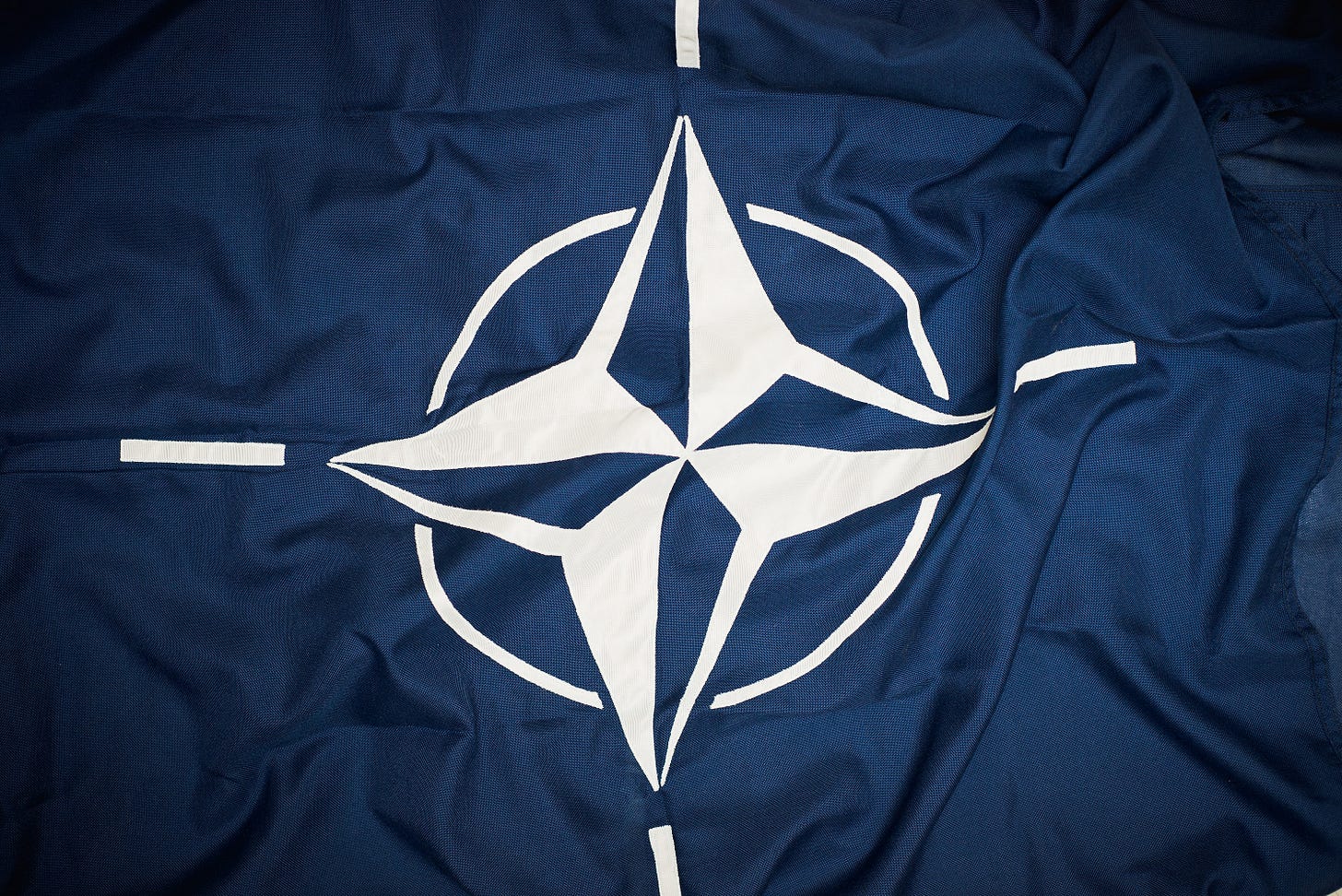A flag of NATO. A flag of NATO.