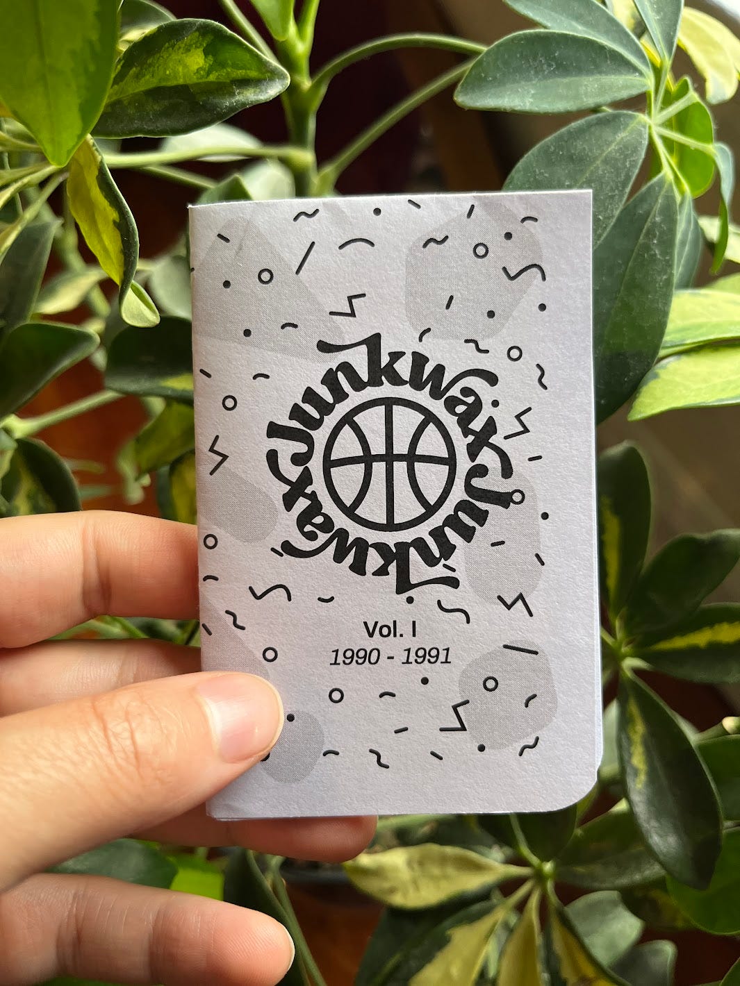 Hand holding Junkwax volume 1 1990-91 zine