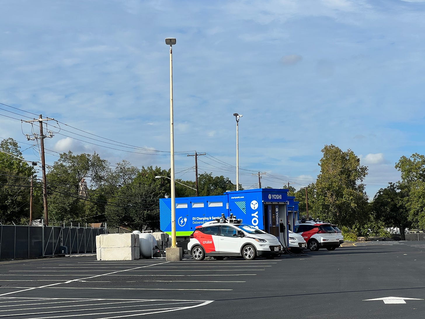 Cruise self-driving cars parked at charging station