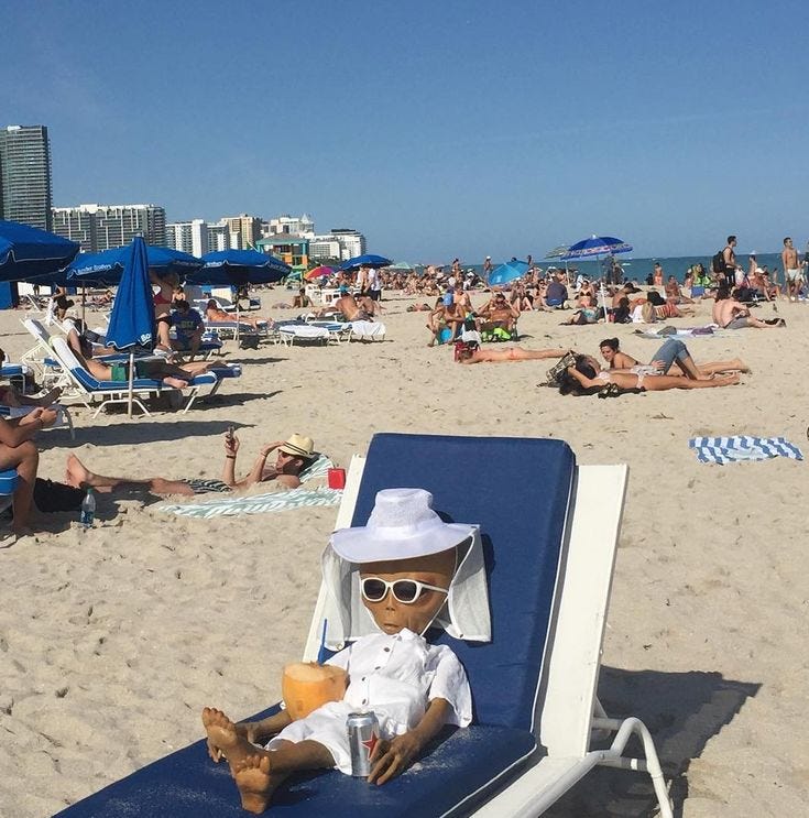 This may contain: a teddy bear sitting on top of a beach chair This may contain: a teddy bear sitting on top of a beach chair