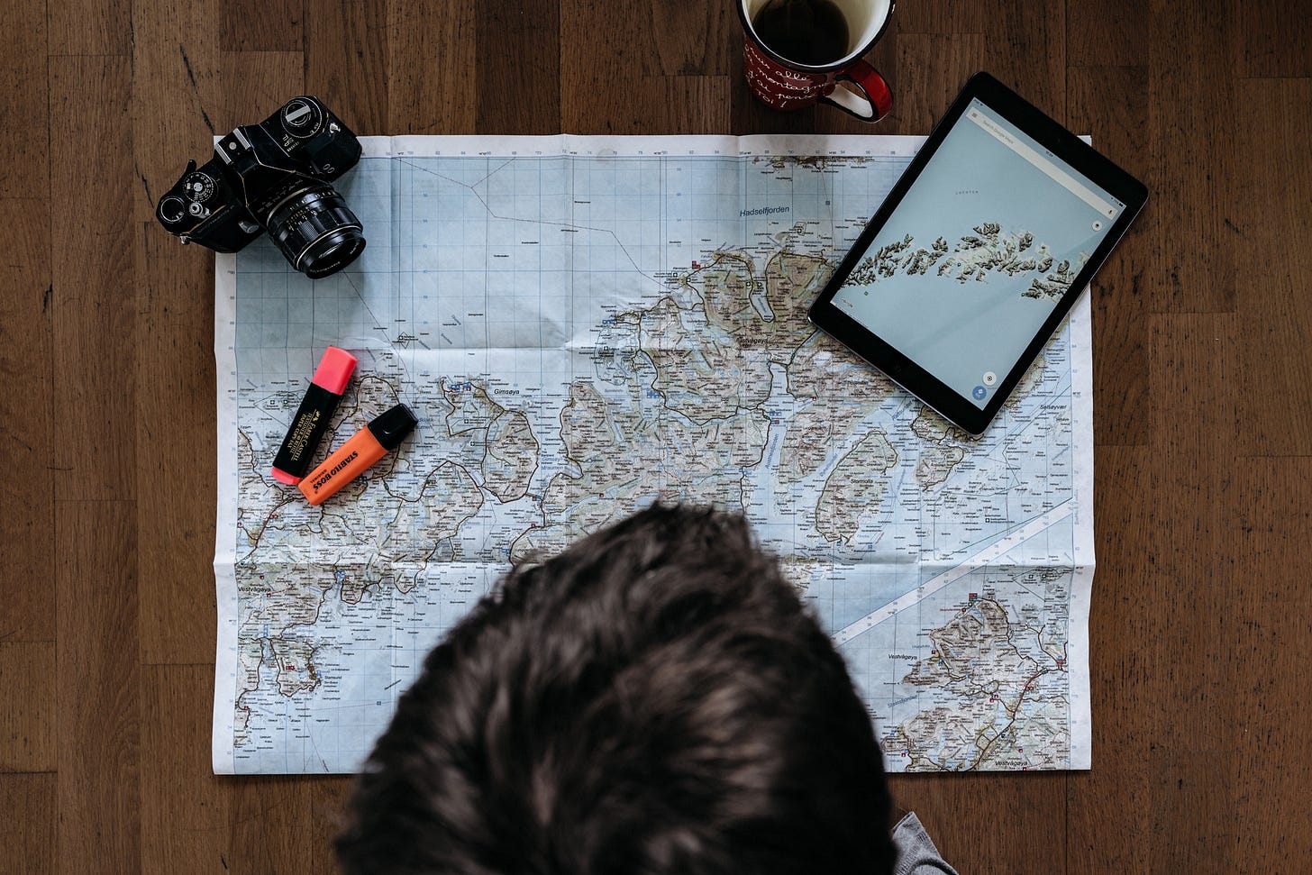 Man looking at map planning an adventure.