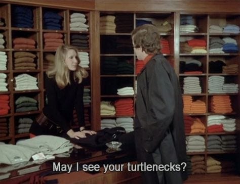 This may contain: a man and woman standing in front of a closet full of folded clothes with the caption may i see your turenecks?