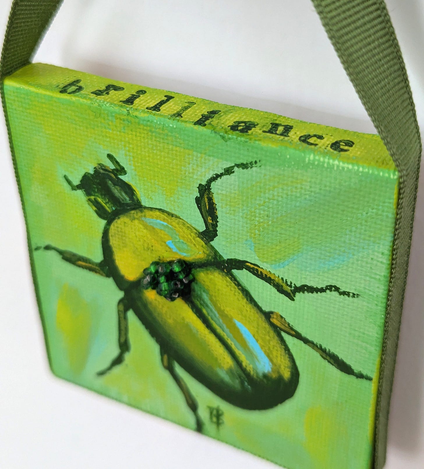 a small painting of a luminescent green beetle on a bright green background a small painting of a luminescent green beetle on a bright green background