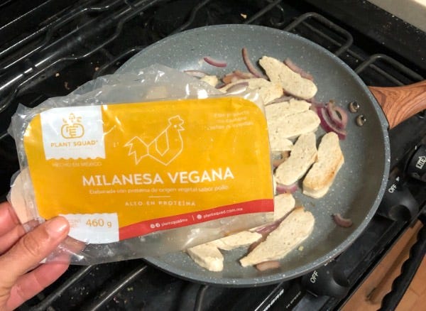 plant squad milanese cooking in a frying pan.