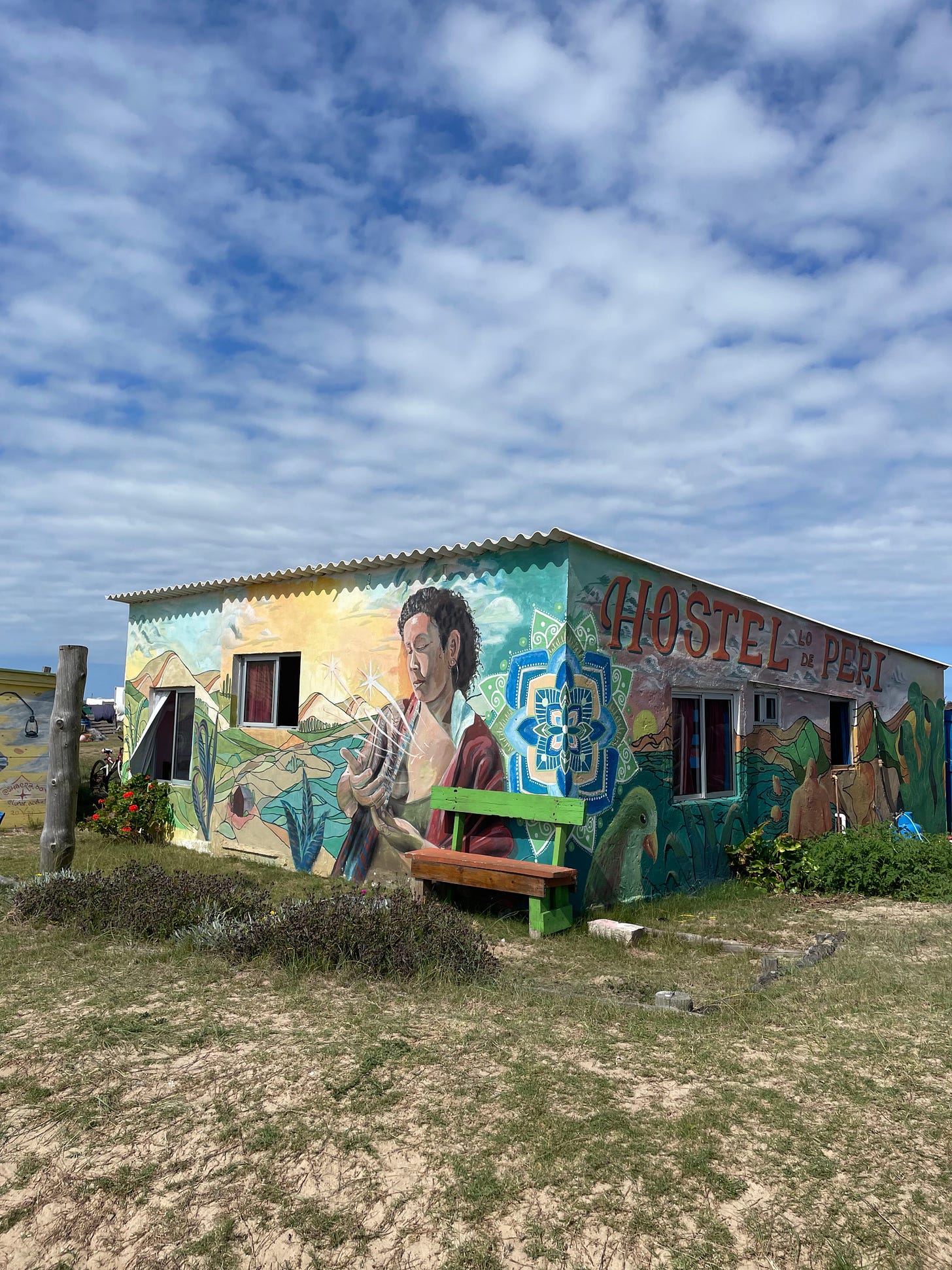 an a hostel in the middle of cabo polonio painted with peruvian art