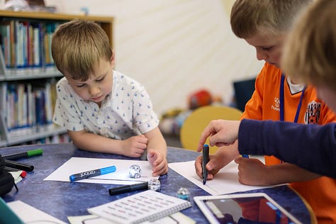 Nine square images from STEM Day, including two students 3d designing, a student sharing his Mars Rover Scratch game, a little kid building with MOLA kit, 3D-Click activities, Tiny robots!, Exploring resources