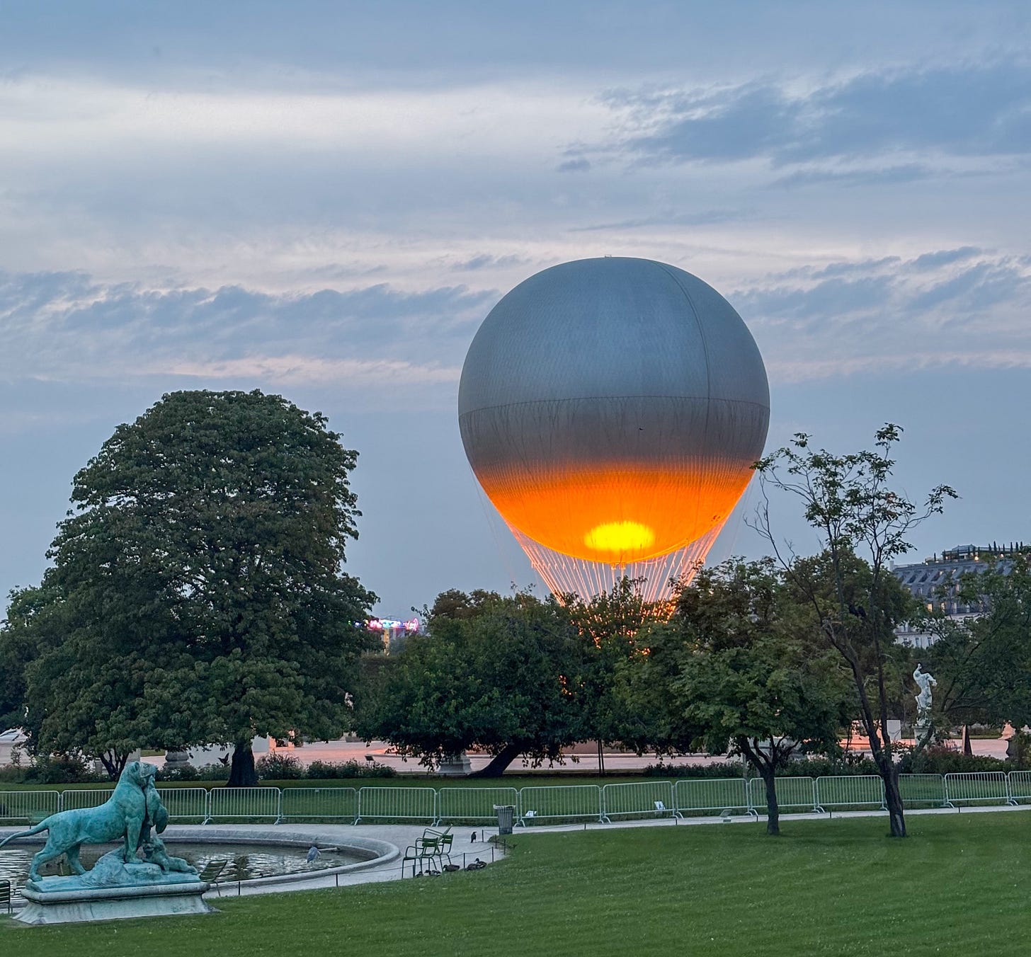 The Paris 2024 Olympic & Paralympic Cauldron in the Jardin des Tuileries in Paris lit orange at dusk in August. The Paris 2024 Olympic & Paralympic Cauldron in the Jardin des Tuileries in Paris lit orange at dusk in August.