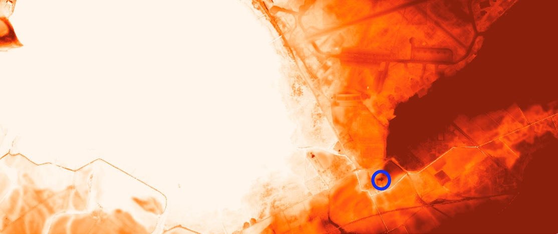 LiDAR image showing a tip of higher land projecting into lower land. A blue circle at the tip of the higher land indicates the site of Kinloss Abbey
