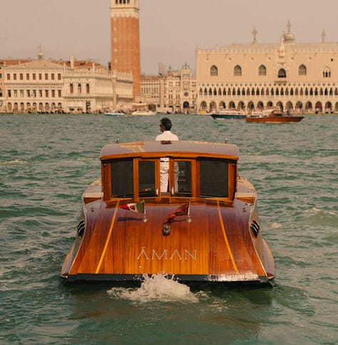 Aman Venice — water taxi, frescoed palazzo interiors, Murano chandelier, piano, and atmospheric details. Photographs by Sara Montalbano and Konstantinos Maximiadis.