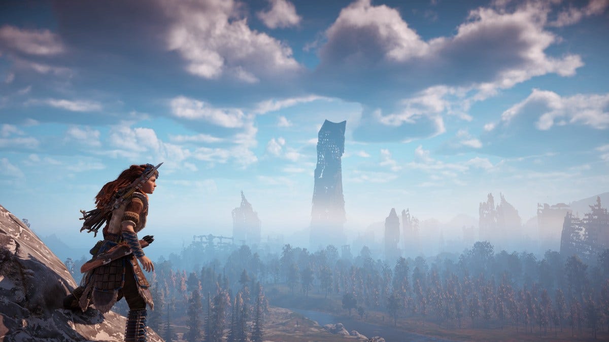 a still from Horizon Zero Dawn (the game) where Aloy stands in the foreground and there are collapsing bones of skyscrapers in the background overgrown with greenery